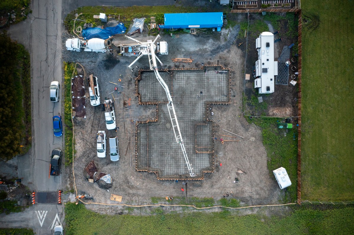 Drone aerial view of the Alan Drive foundation pour — full construction site